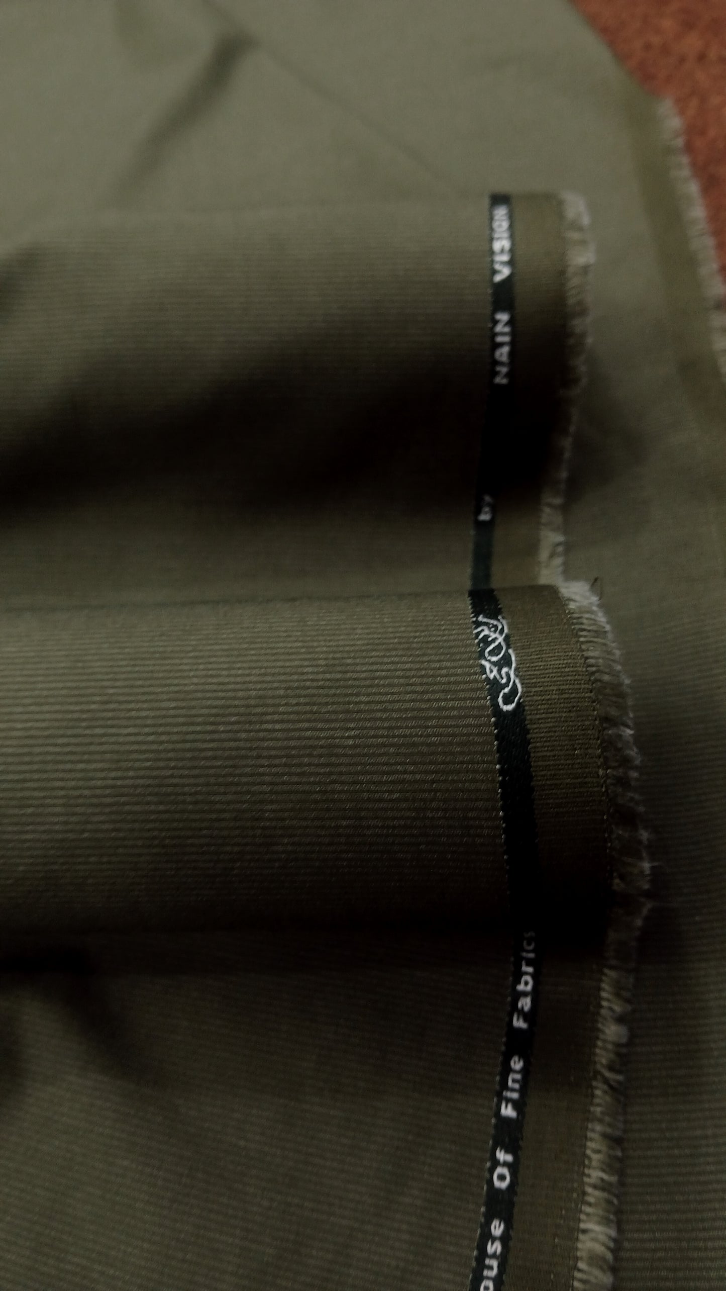 Olive Green Wash & Wear – Premium Mid Winter Self Lining Fabric for Men | Unstitched Men’s Suit Fabric Pakistan